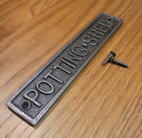 Cast iron wall mounted potting - wall,