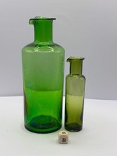 2 old green glass bottles with