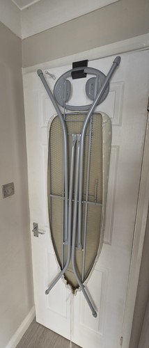 Iron board holder fits on - board,