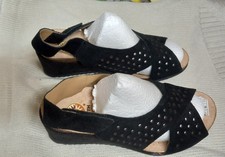 New Ladies Wedge sole shoes size 6. Cross straps with adjustable heel strap.