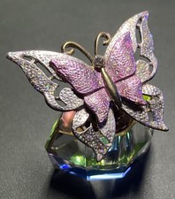 Glass Perfume Bottle With A Decorative Pink And Silver Butterfly Cap. 6x 5x 4 cm