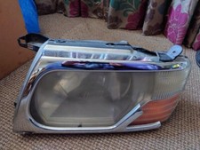 2006 MITSUBISHI SHOGUN MK3 PASSENGER FRONT HEADLIGHT  - Damaged Good Lens
