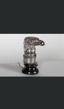 A mauve crystal 'Tête d'Aigle' car mascot by René Lalique, c.1928.