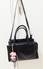 Radley black leather grab bag with detachable shoulder strap, pretty charm