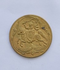 "HOLSTEN PILS, THE ODD LAGER" TOKEN, FEATURING A MAN ON A HORSE