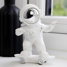Skateboarding Astronaut Figure