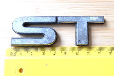 ST METAL CAPITAL LETTERS 8.5cm. DATSUN  SPORT TRUCK (probably) BADGE 75444 14 28