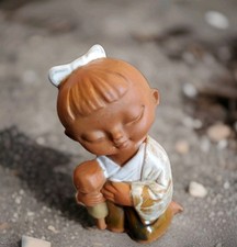 Kneeling Japanese Girl Holding