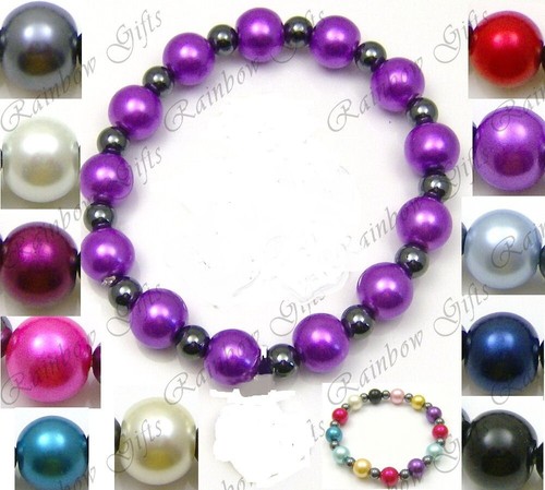 Glass hematite bead - &,
