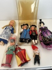 7 mixed souvenir dolls