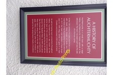 Photo A2 A History of Auchtermuchty Summarised in a plaque by the door o c2014