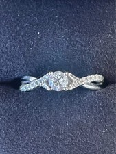 Tolkowsky 18ct White Gold Twist Ring, 0.25ct Round Brilliant Diamond. Size J. 