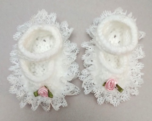 Hand knitted dolls clothes
