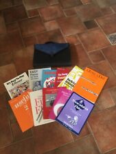 FLUTE MUSIC BOOKS AND CASE IN GOOD CONDITION/COUPLE HAVE WRITING IN. GOOD BUY 