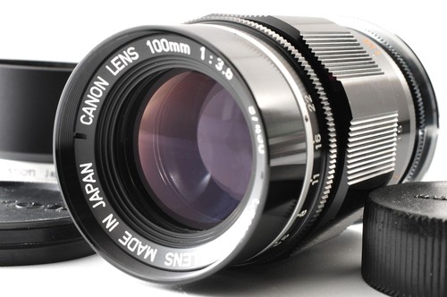 Near mint hood canon 100mm - w/hood],