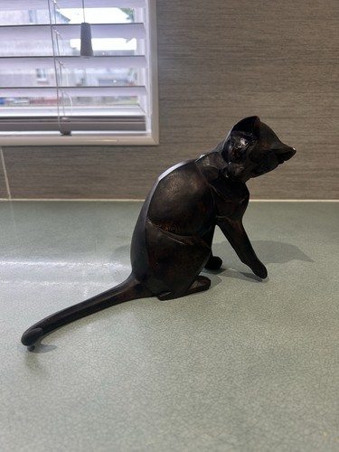 Hand carved wooden cat - hand,