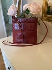 TULA  Leather Burgundy/Maroon Crossbody bag with adjustable strap, hardly used.