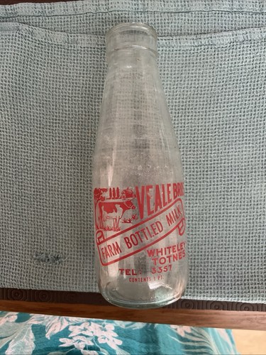 Olde milk bottle with farm - milk,
