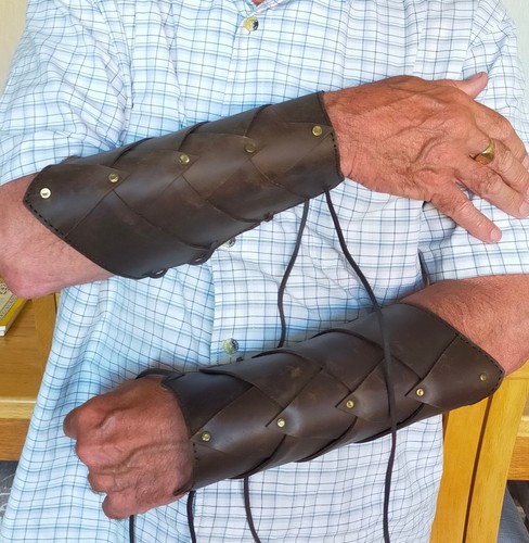 Pair leather studded arm - of,