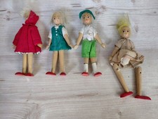 Collection of 4 Wooden Dolls