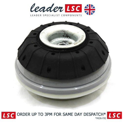 Front top strut shock - front,