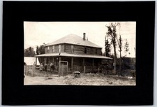 Large Log Cabin Late in Winter, Family Outside Working - Photograph