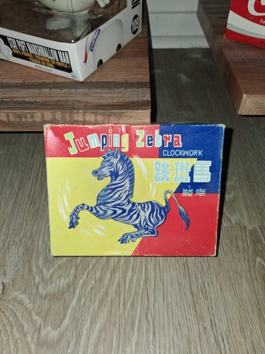 Jumping metal zebra with box - zebra,