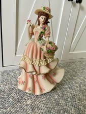 Regency Fine Arts ‘Gathering Flower’ Lady ornament.