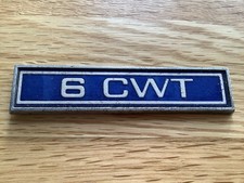 6 CWT METAL BADGE ex FORD ESCORT Mk.1 VAN. J.Fray Part No.JF 4163 no fixing pins