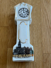 crested grandfather clock -