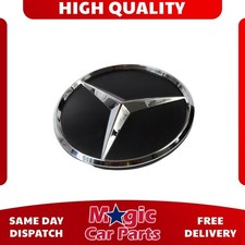 Genuine rear door star emblem - rear,