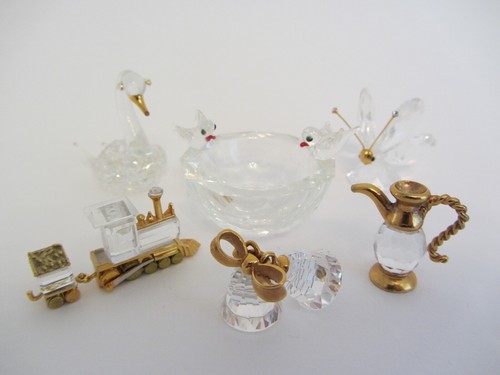 Swarovski - x,