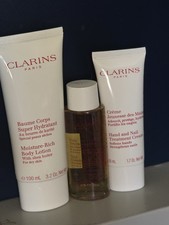 Clarins 3 products With Bag