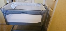 Chicco next 2 me magic crib, including mattress and bedding. 