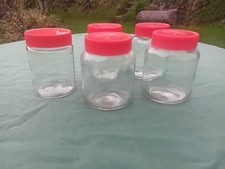 Jars x5 for preserves, crafts, storage, etc. Glass jars with red plastic lids.