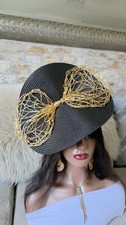 Black  Straw  Fascinator Beautifully Embellished with a large Gold bow.