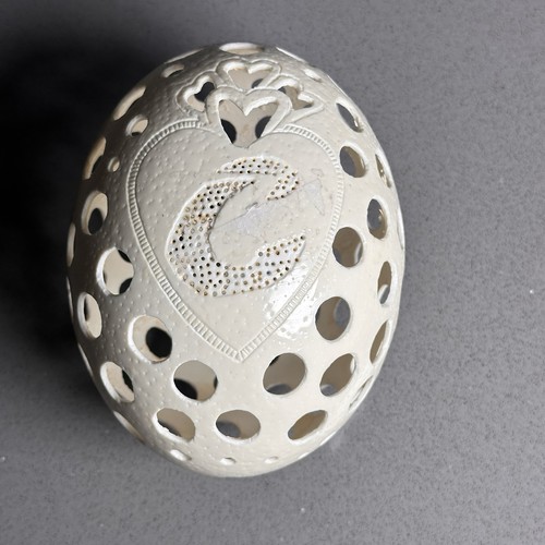Hand carved ostrich egg shell - hand,