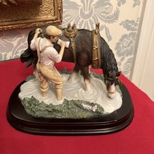 LEONARDO FARMER AND HORSE FIGURINE ON WOODEN PLINTH