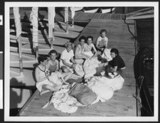 Seven women in sports attire