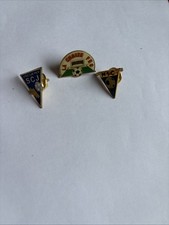 Three Football Metal Badges. 