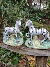 PAIR OF VICTORIAN STAFFORDSHIRE FIGURES OF ZEBRA BY THOMAS PARR