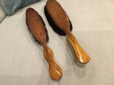 Pair of antique wooden clothes brushes