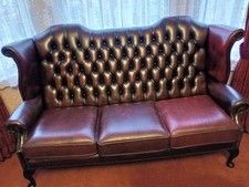 Queen Anne style three seater burgundy leather sofa, as described.