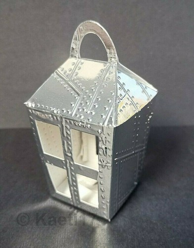 Silver riveted embossed sizzix