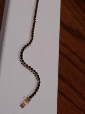 14ct GOLD BRACELET WITH BLACK STONES