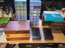 Various slide storage boxes, including wooden cases and plastic modular boxes
