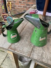 Vintage Castrol oil jugs in