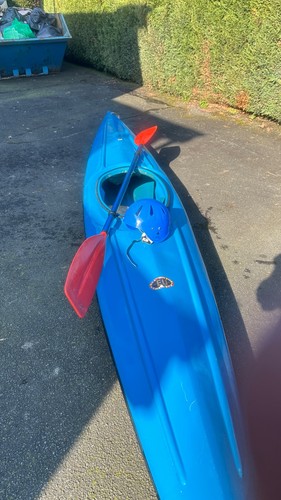 Kayak with paddle and helmet - and,