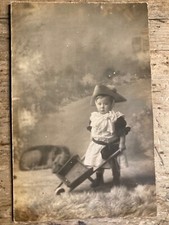 Real Photo Postcard.  Child With Wheel Barrow.     ref683