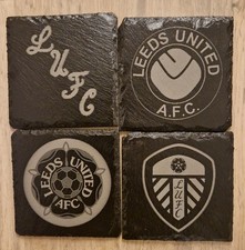 Leeds United Black Slate Costers Mixed Set Of 4 Badges.